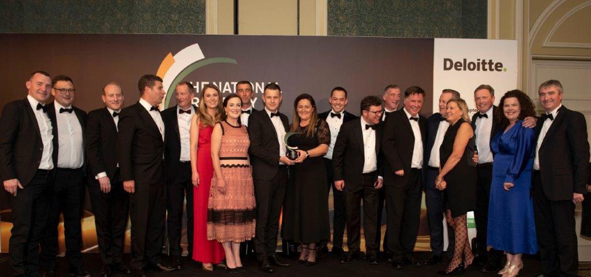 Cairn team with their trophy on stage at The National Property Awards